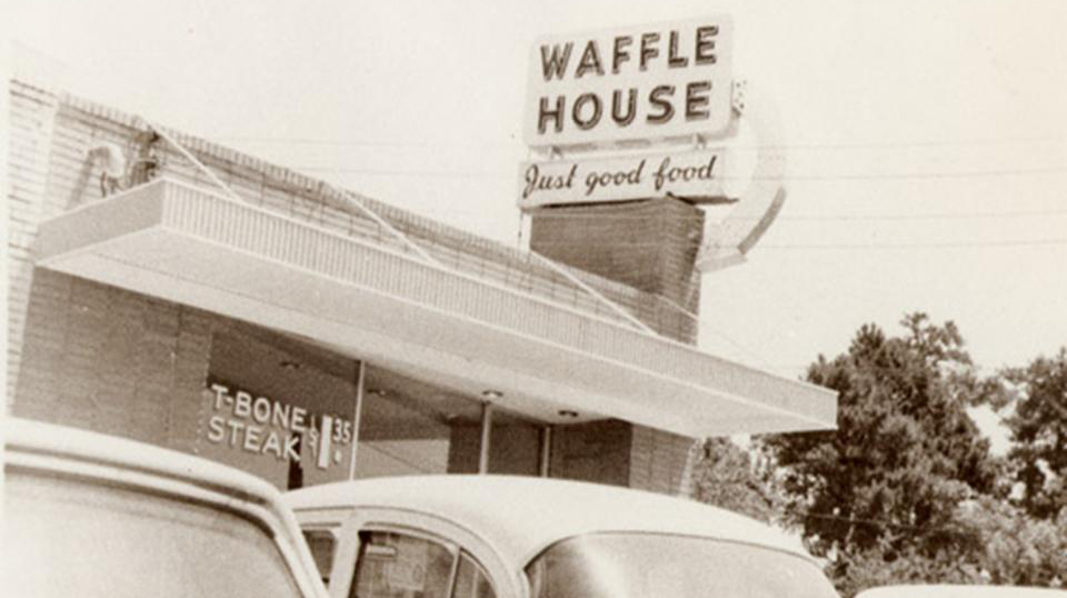 Black and white photo of original Waffle House sign
